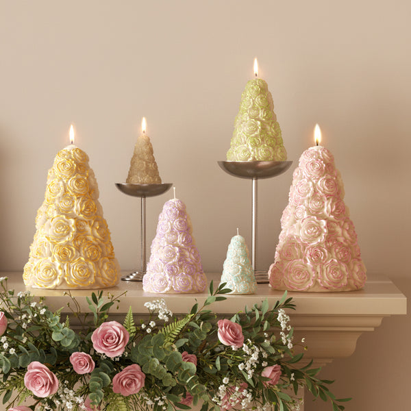 Pastel rose tree pillar candles in multiple sizes on a mantel with flowers for wedding and holiday décor - Boowan Nicole