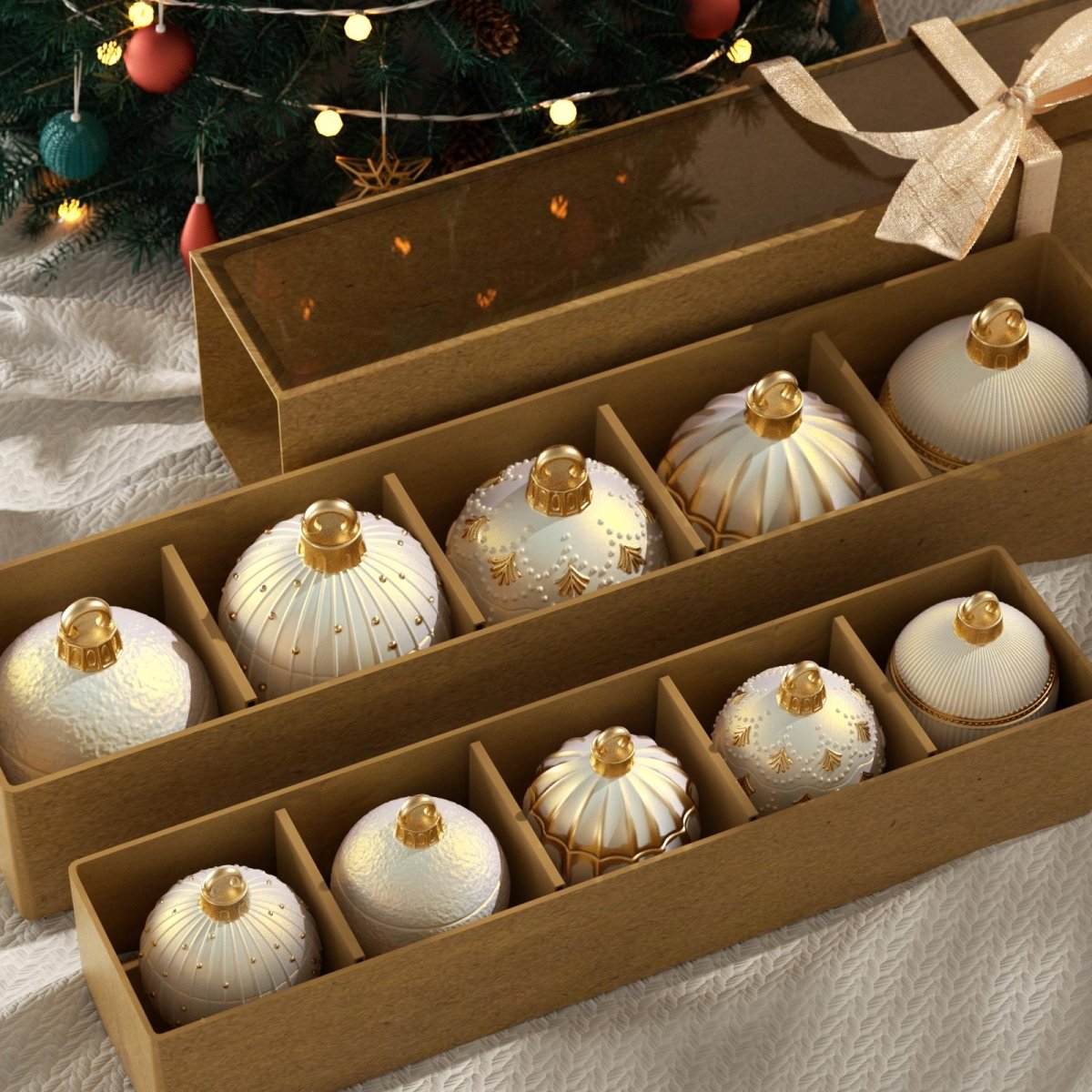 Elegant gold and white Christmas bauble candle jars neatly arranged in a wooden gift box with ribbon, placed under a decorated Christmas tree - Boowan Nicole