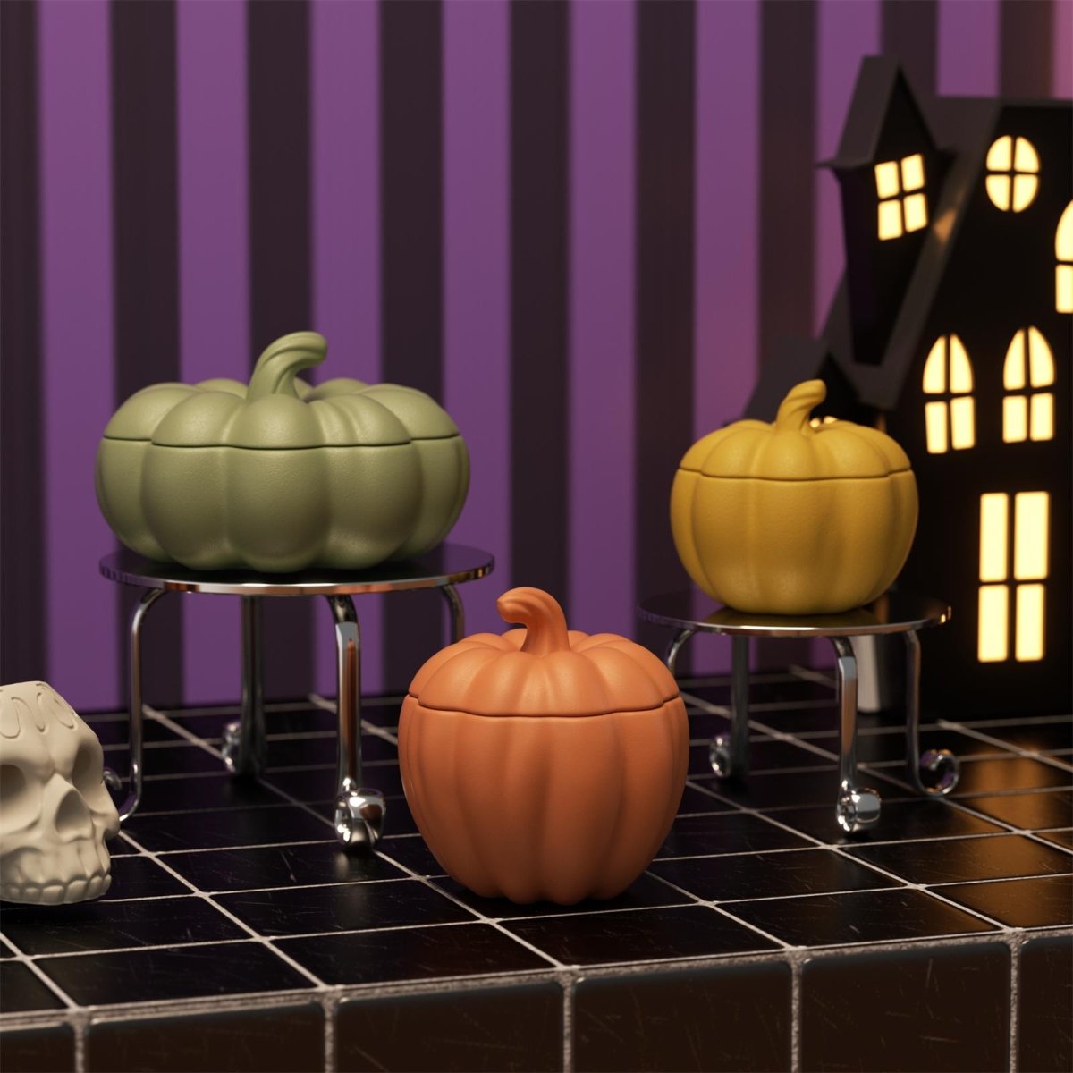 Pumpkin-shaped candle jars paired with spooky Halloween decor – in green, orange, and yellow - Boowan Nicole