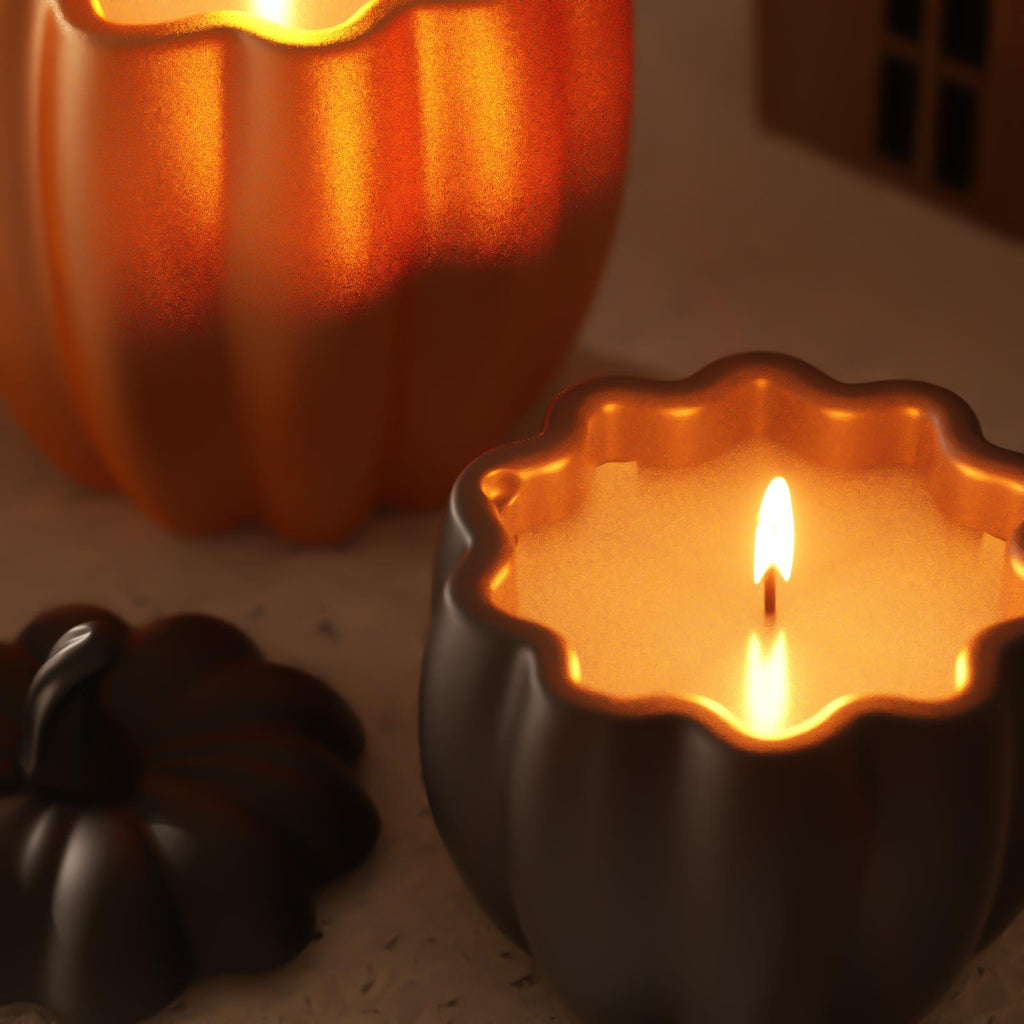 Close-up of glowing pumpkin-shaped candles in orange and black jars – Halloween-inspired cozy candlelight scene - Boowan Nicole