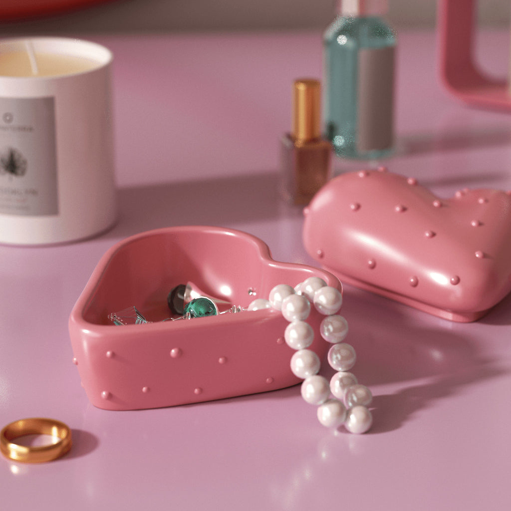 Pink dotted heart-shaped candle jar and lid used as a jewelry trinket dish with pearls - Boowan Nicole