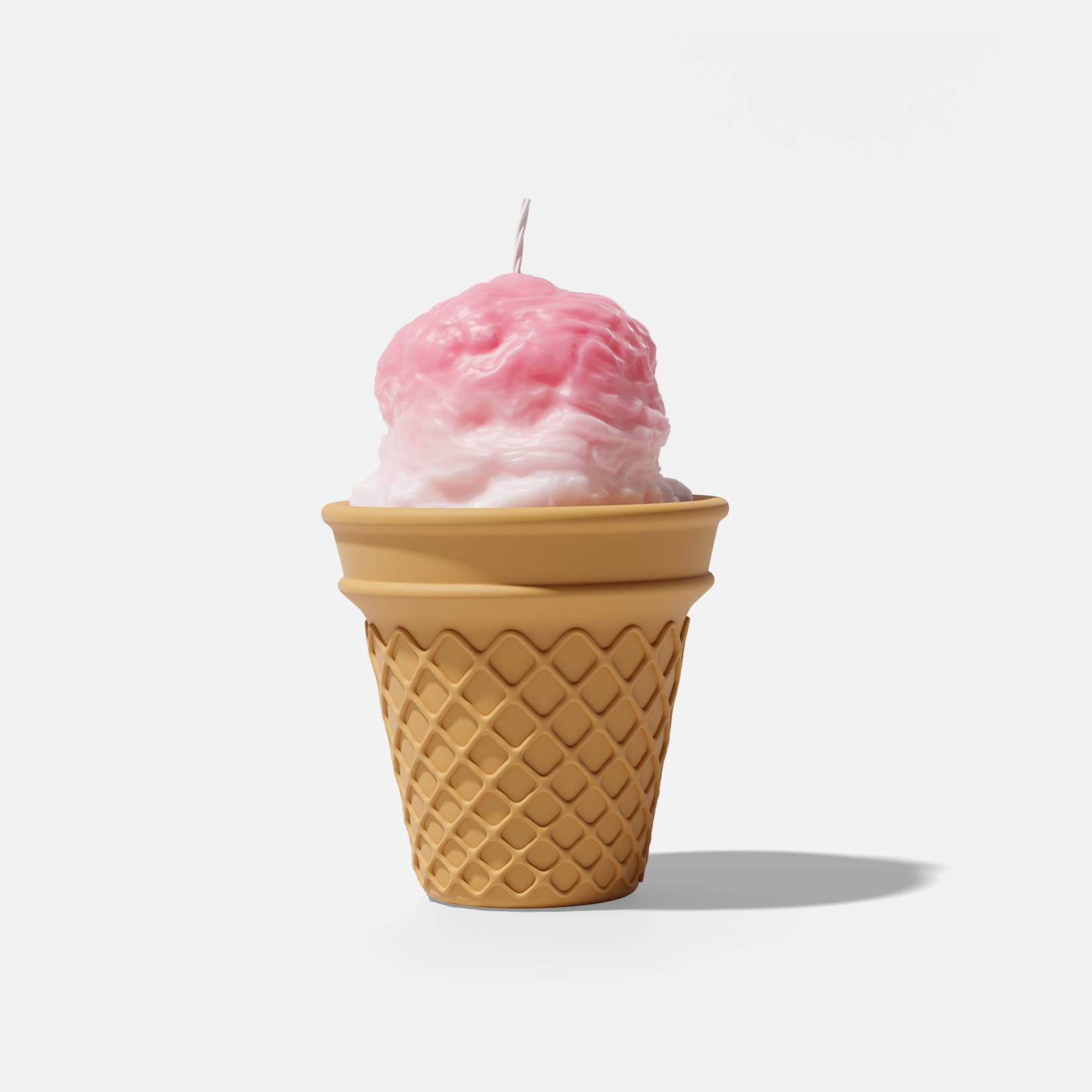 Pink and white ombre ice cream scoop candle in a brown waffle cone vessel, unlit, on a plain white background - Boowan Nicole