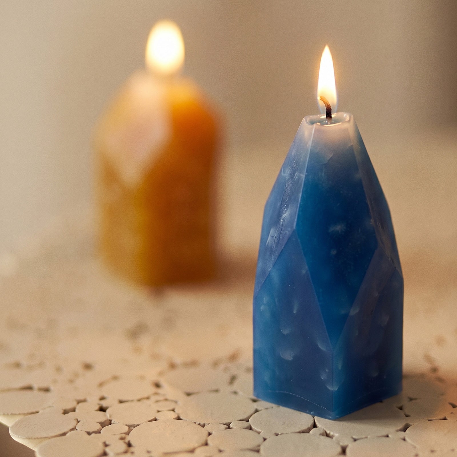 Close-up of Lit Blue Crystal Candle - Boowan Nicole