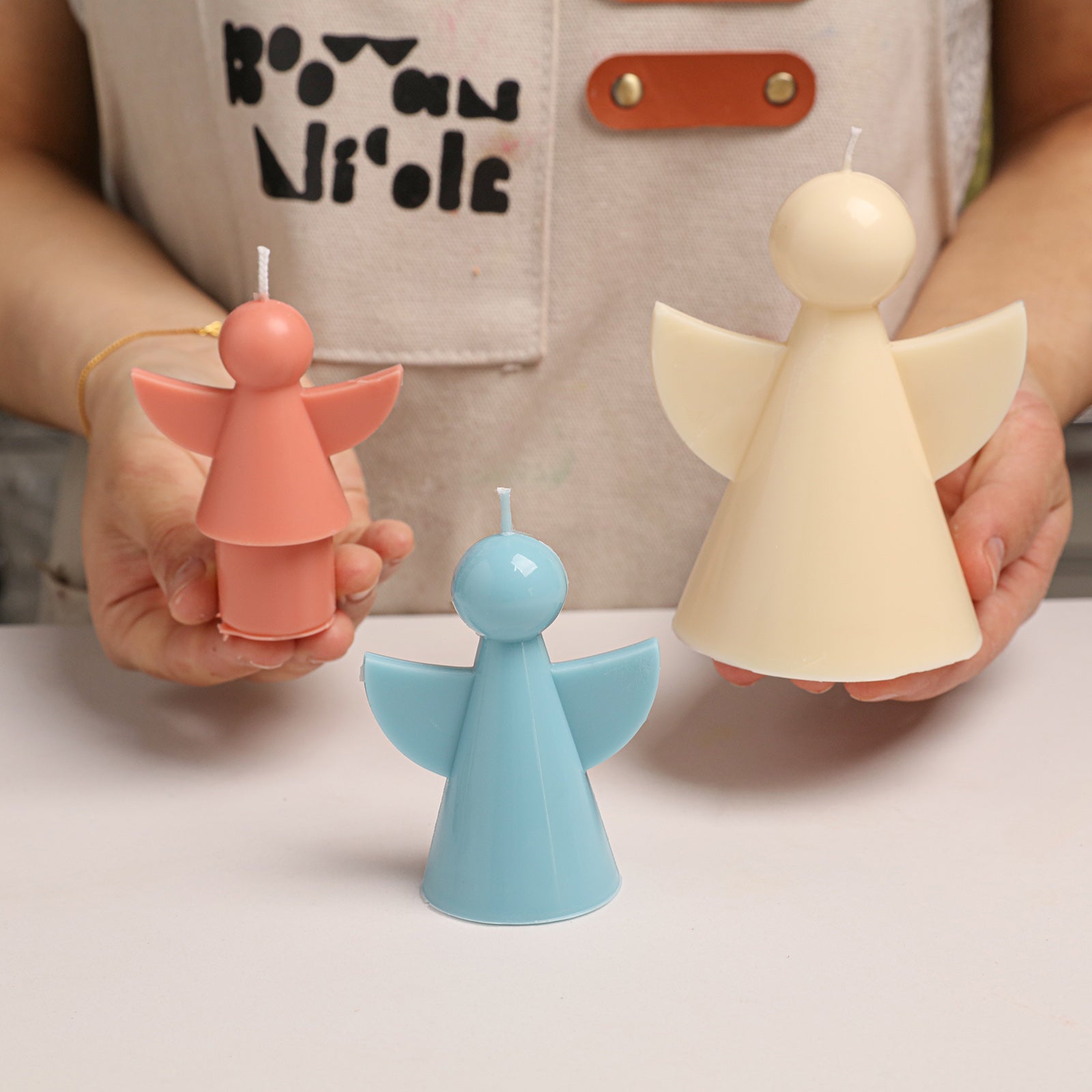Hands Holding Finished Angel Candles - Boowan Nicole