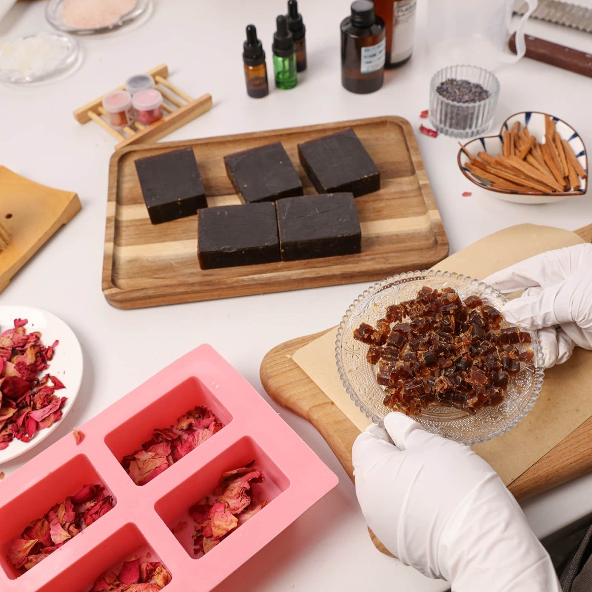 Handcrafting Damask Rose Essential Oil Soap Bar with natural rose petals in a pink mold and premium botanical ingredients - Boowan Nicole