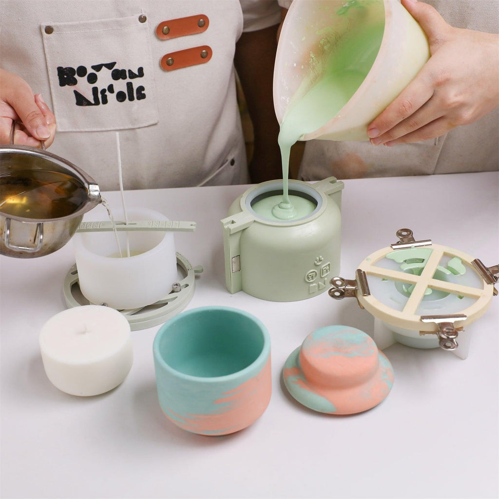 Pouring green concrete mix into silicone mold with support shell - Boowan Nicole