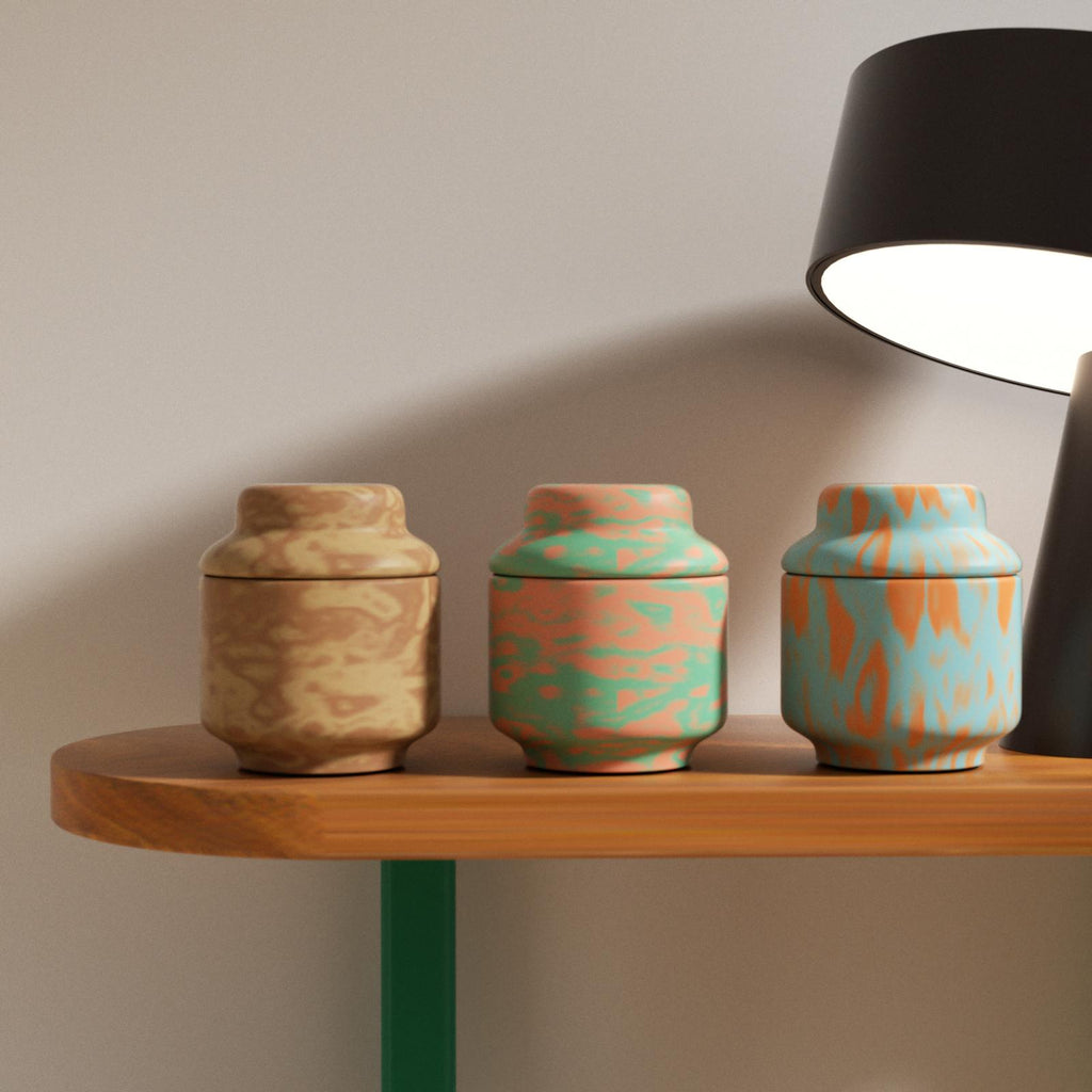 Set of marbled concrete candle jars in earthy tones on wooden shelf – handmade decorative containers - Boowan Nicole