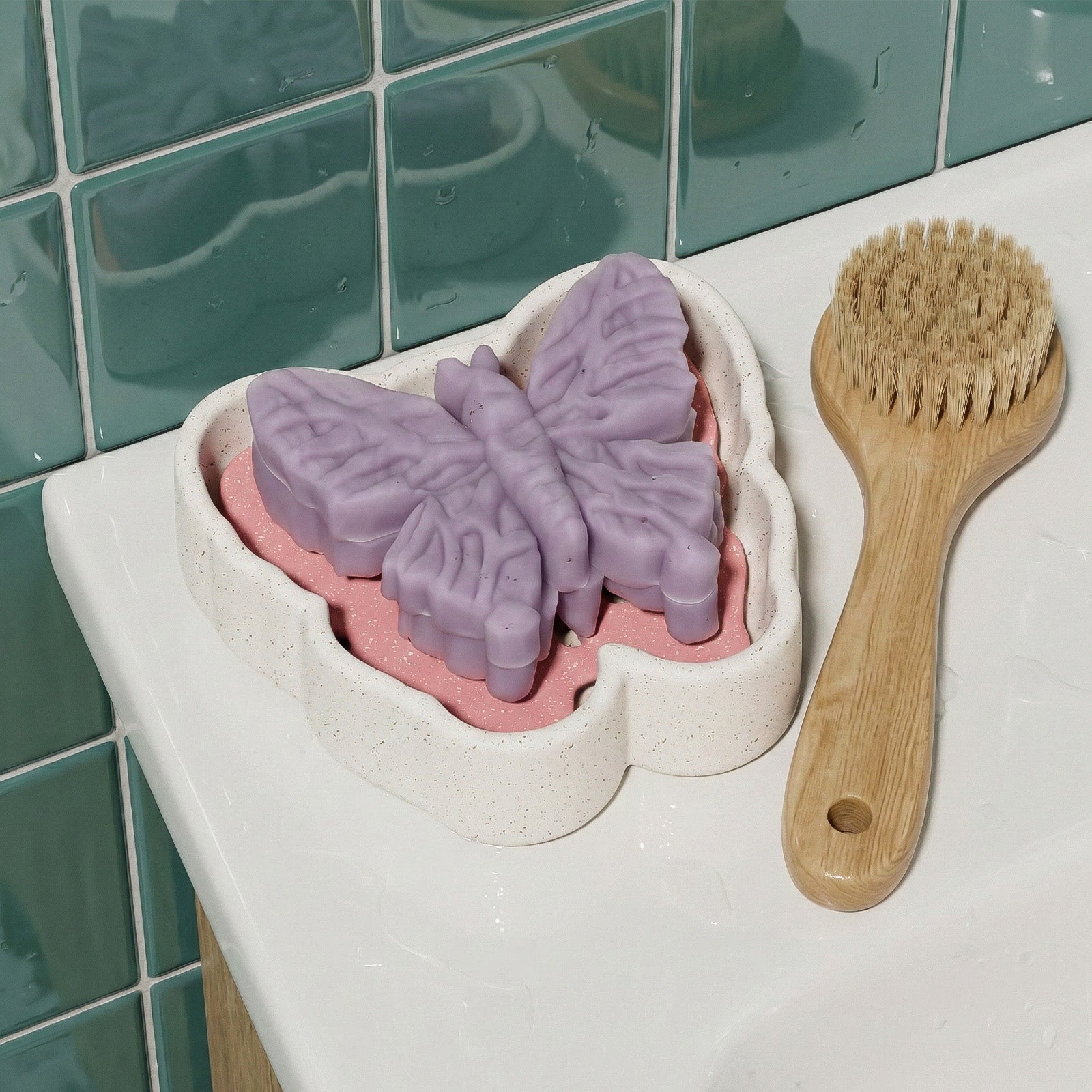 Purple butterfly soap resting on a matching butterfly-shaped drainage dish in a bathroom setting - Boowan Nicole