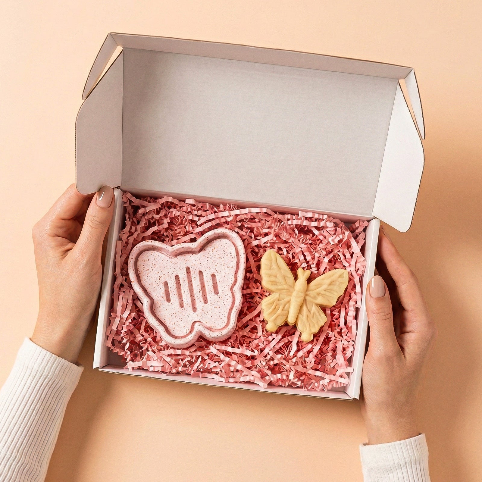 Gift box containing a butterfly-shaped drainage dish and a yellow butterfly soap, presented with pink shredded filler - Boowan Nicole