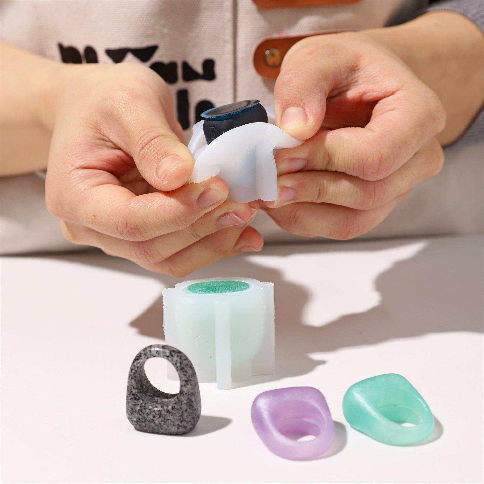 Demolding a blue resin ring from a silicone mold-Boowan Nicole