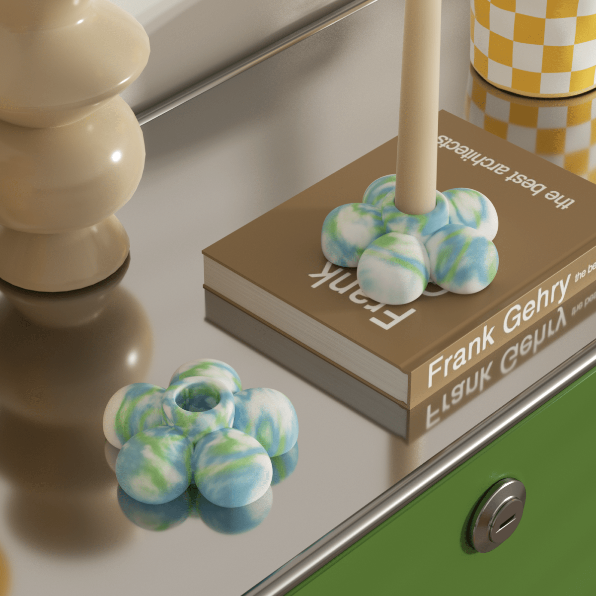 A gradient green and blue flower candle holder paired with a candle, placed on a stainless steel table-Boowan Nicole