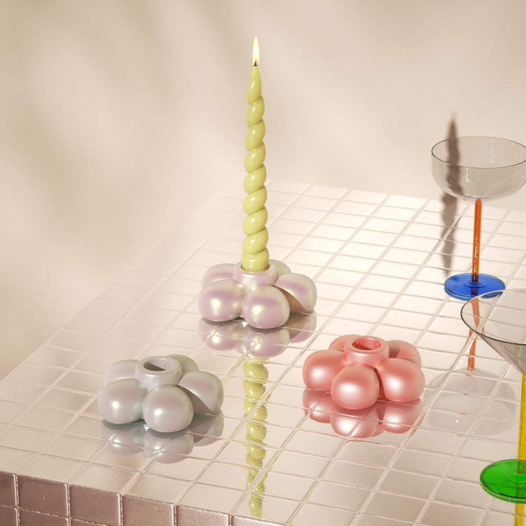 Colorful flower-shaped candle holders in soft pastel hues, perfect for adding a playful touch to modern table settings-Boowan Nicole