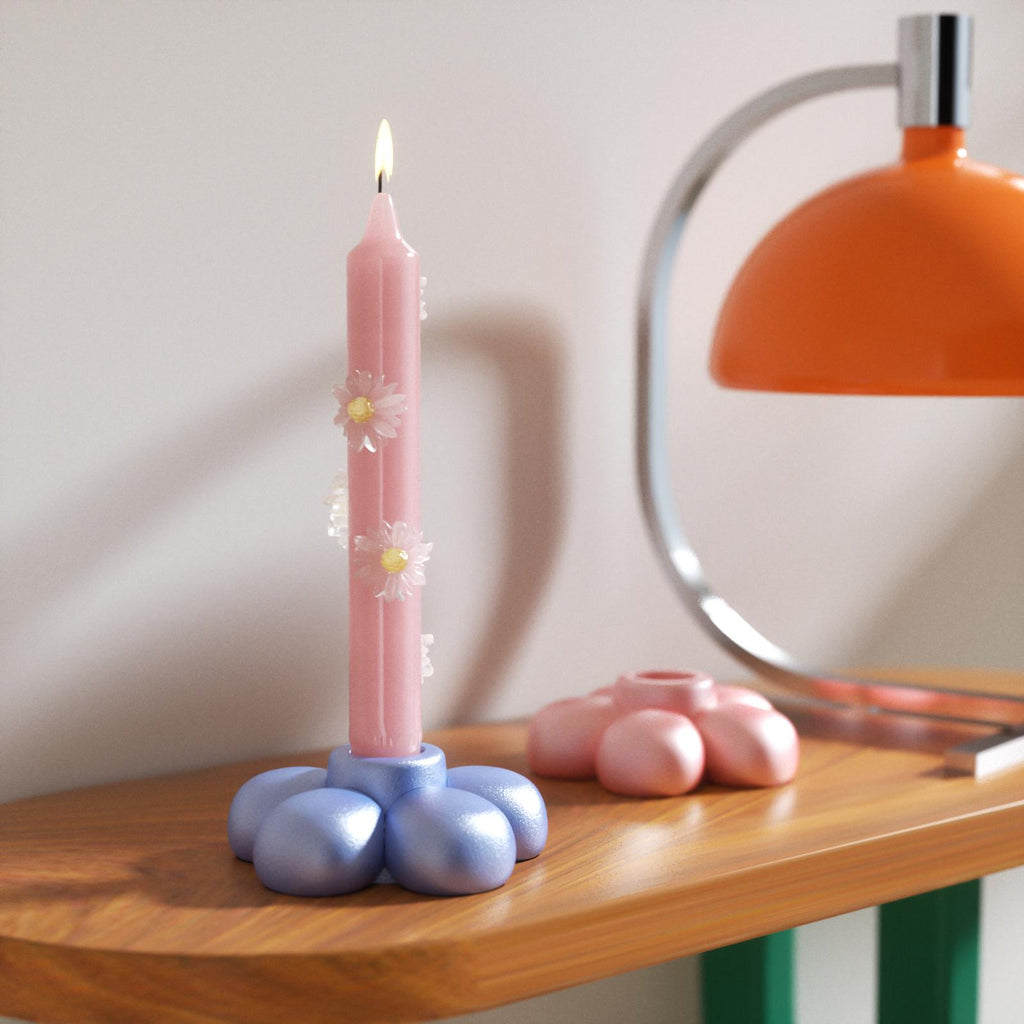Pastel blue flower-shaped candle holder paired with a pink daisy candle, adding a whimsical and modern touch to your decor-Boowan Nicole