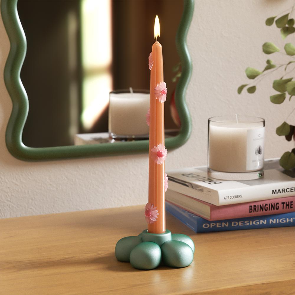 Green flower-shaped candle holder paired with a pink daisy candle, adding a whimsical and modern touch to your decor-Boowan Nicole