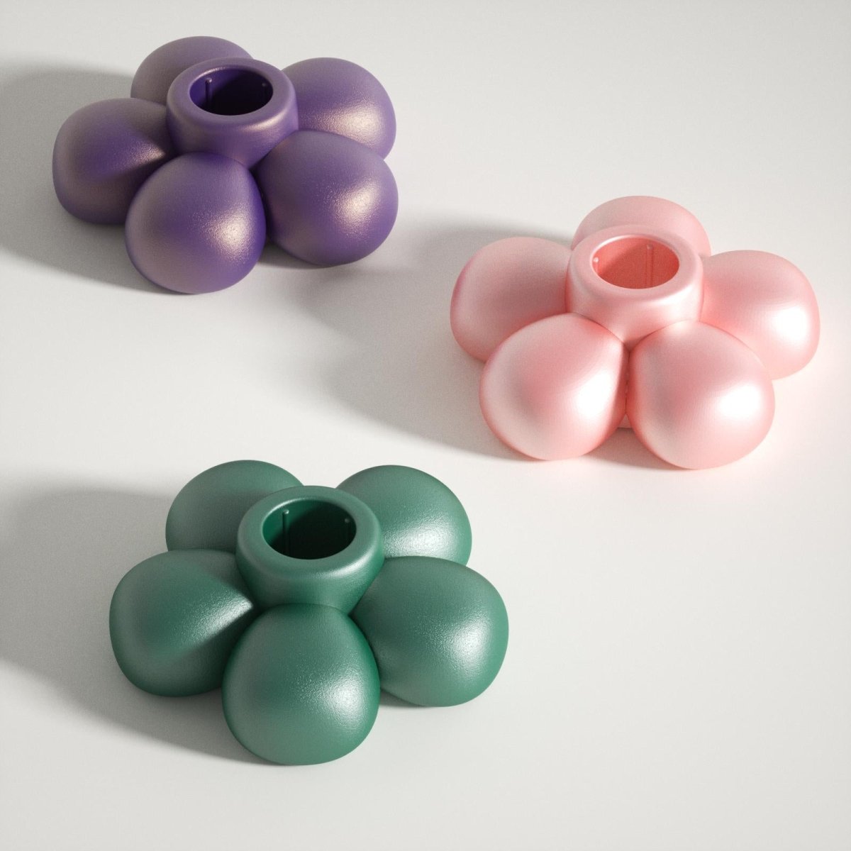 Pearlescent pink, purple, and green blooming flower-shaped candle holders, adding a vibrant touch to your decor-Boowan Nicole