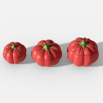 Set of three red tomato-shaped jars with green stems in small, medium and large sizes displayed on a white background - Boowan Nicole