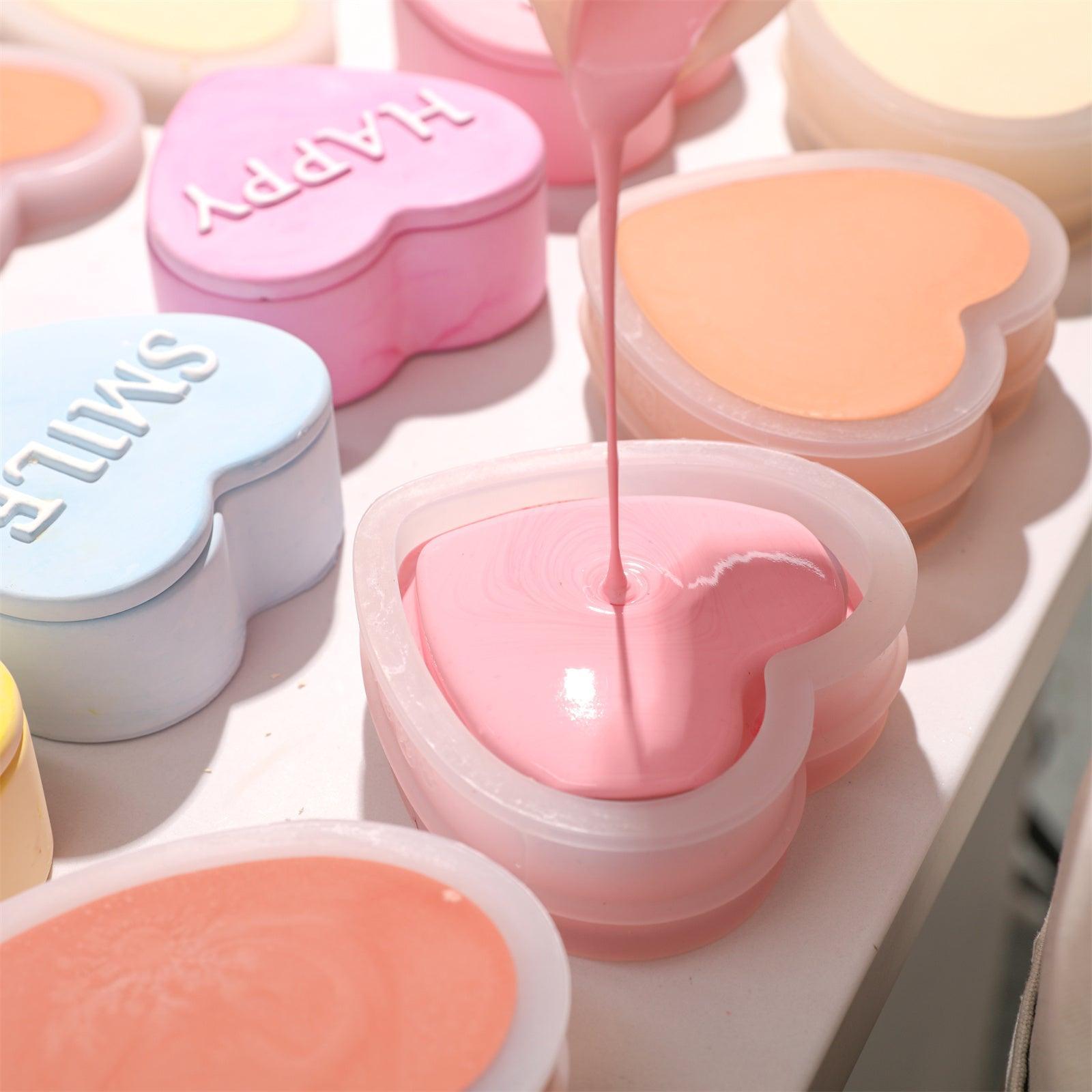 Mixed pink concrete is filled into the heart-shaped storage jar silicone molds-Boowan Nicole