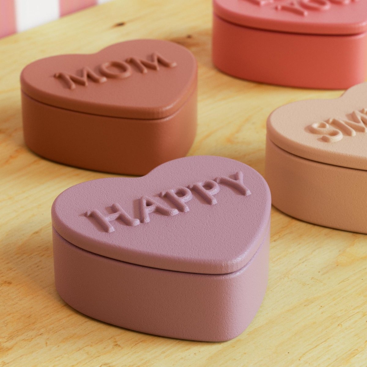 Heart-shaped storage boxes with embossed words like "MOM," "HAPPY," and "SMILE," perfect for expressing love and positivity as home decor-Boowan Nicole