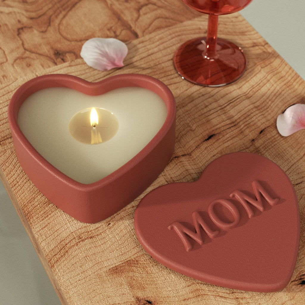Heart-shaped candle holder with a lit candle, accompanied by a "MOM" embossed lid, creating a warm and sentimental ambiance-Boowan Nicole