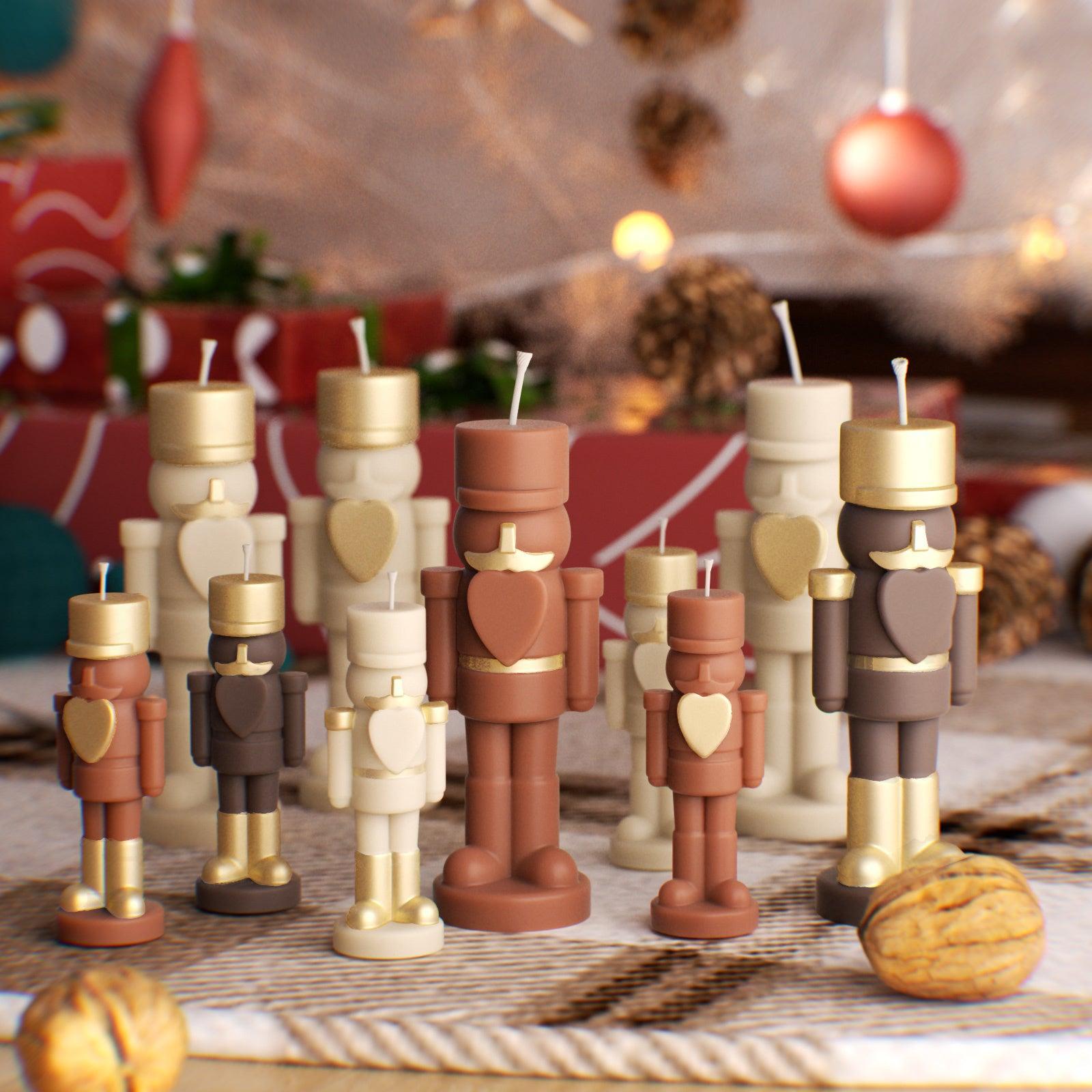 Batch-made nutcracker candles in festive colors—perfect for holiday gifting, small business sales, or seasonal home decor - Boowan Nicole