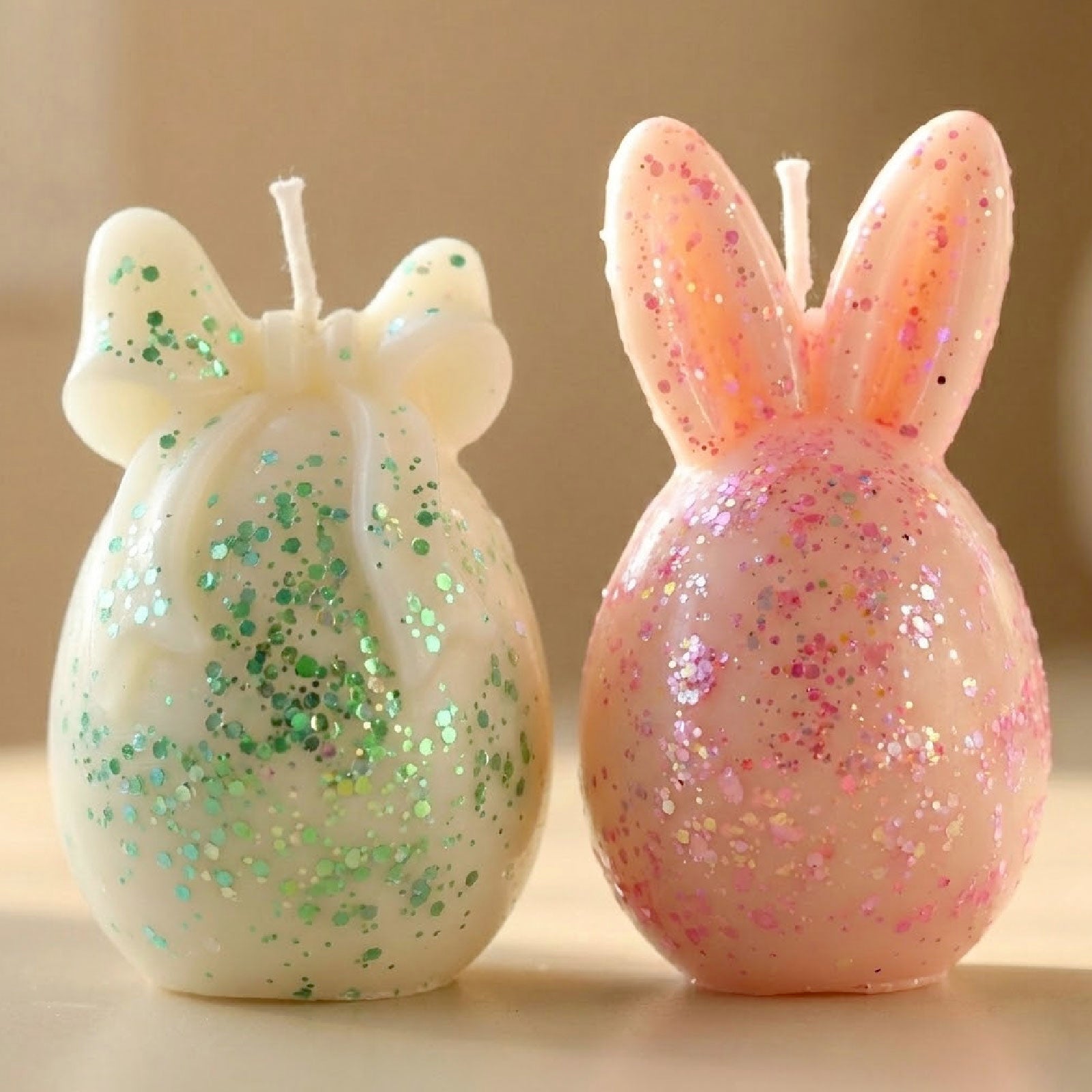 Sparkling glitter Easter candles in bunny ear and bow shapes, pastel pink and cream colors - Boowan Nicole