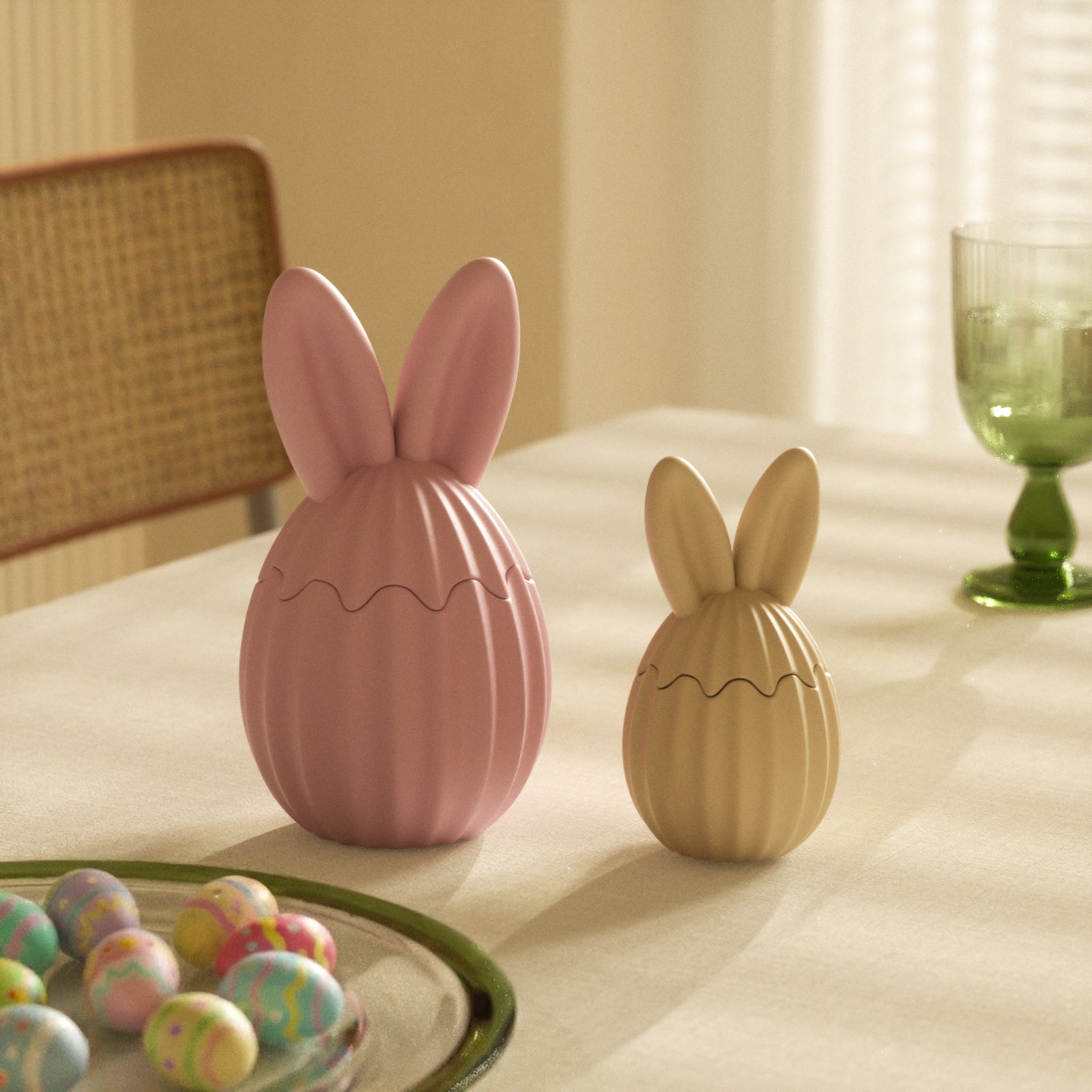 Large pink and small yellow ribbed bunny egg jars on a sunny Easter table setting - Boowan Nicole