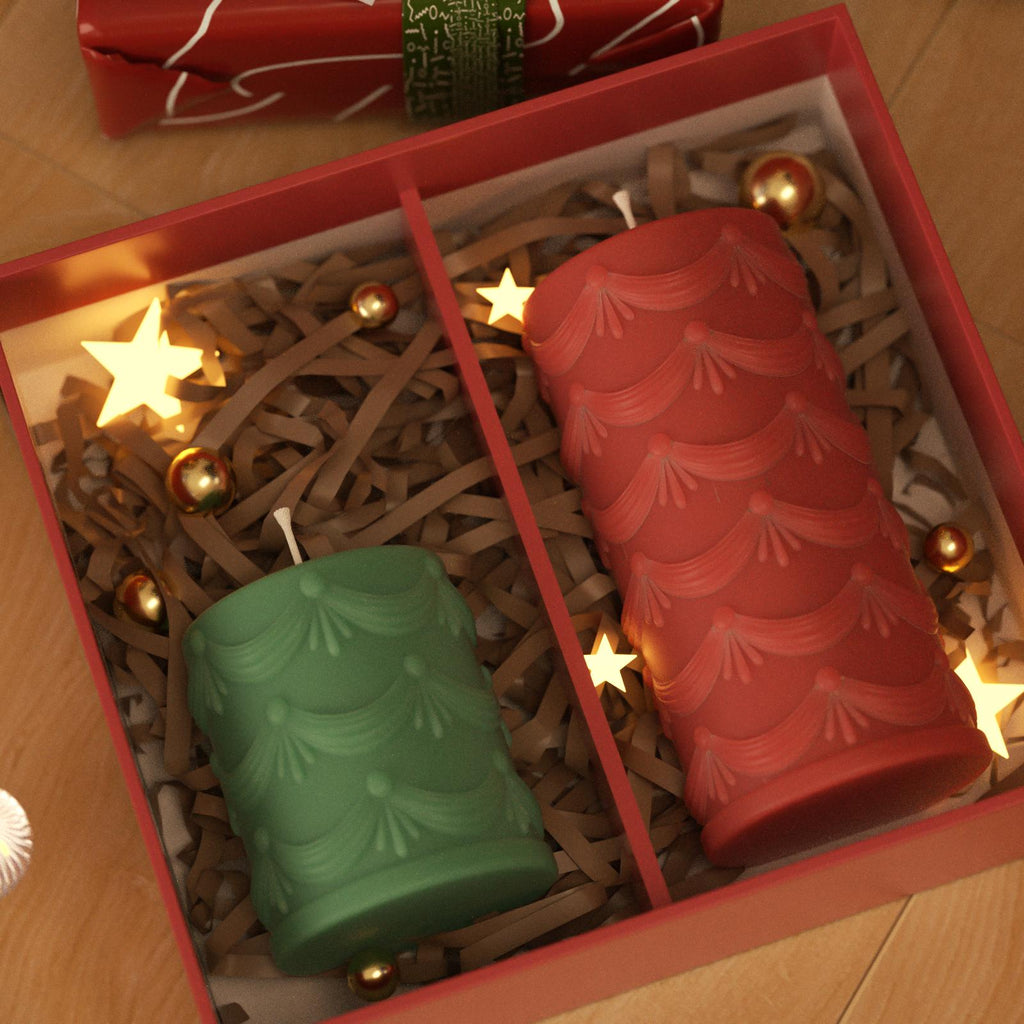 Holiday gift box with Christmas-themed pillar candles in red and green, surrounded by festive decorations - Boowan Nicole