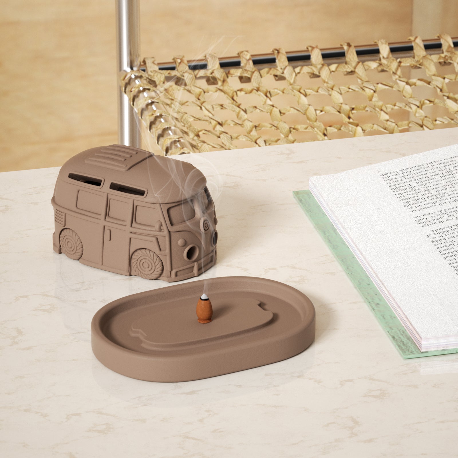 The cover of the retro station wagon-shaped incense burner is placed on the table, and the cone-shaped incense is lit in the tray of the incense burner.