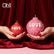 Red and pink "LOVE" round candles with dripping wax effect for Valentine's Day decor - Boowan Nicole