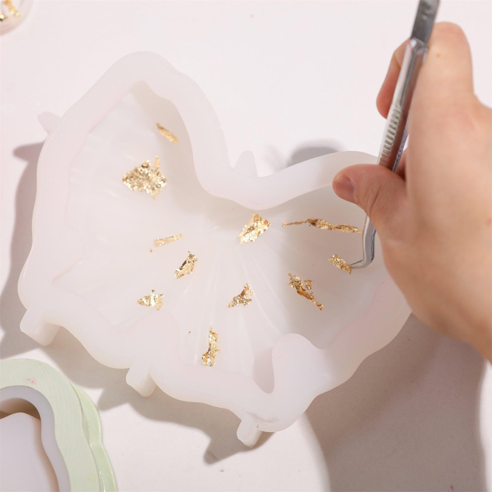 Gold leaf carefully hand-placed in silicone mold using tweezers-Boowan Nicole