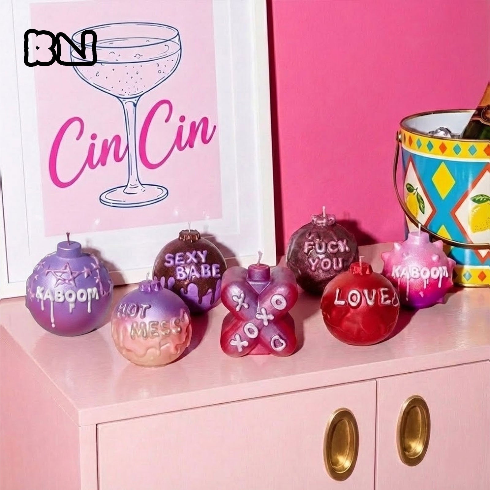 Large Boomy Love 3D quote candles in vibrant gradients on a pink cabinet - Boowan Nicole