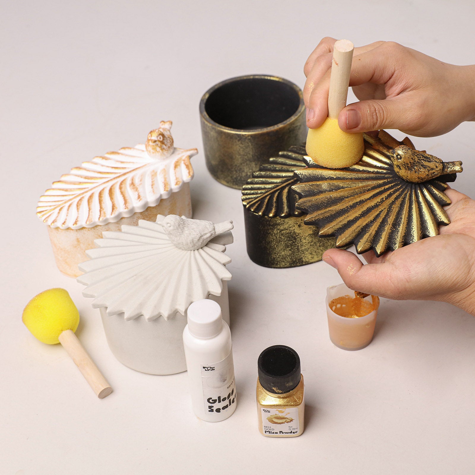 Painting Bird & Leaf Candle Jar lids with metallic gold powder - Boowan Nicole