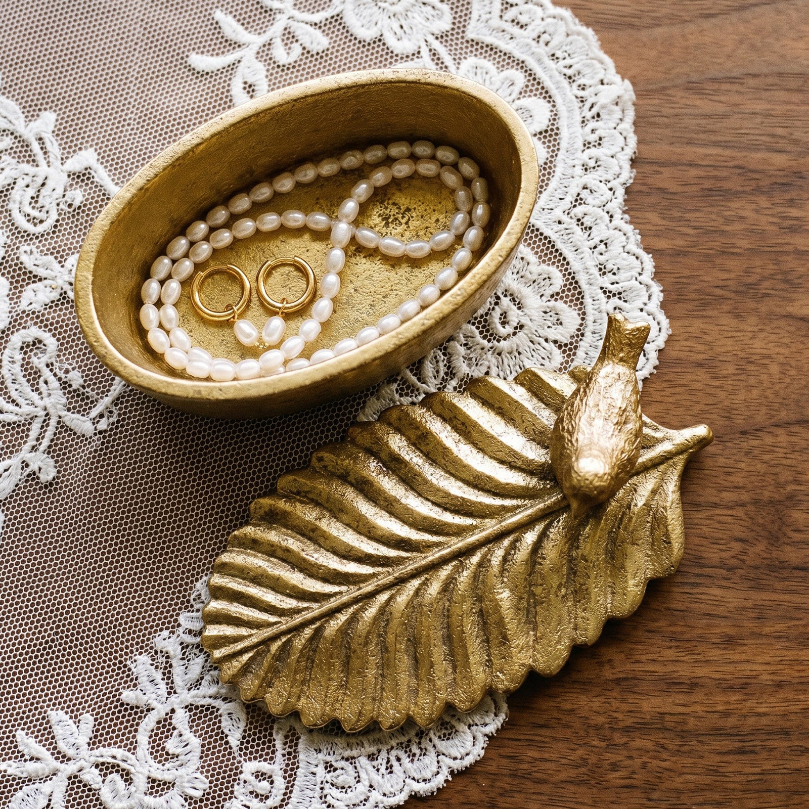 Bird & Leaf Candle Jar holding jewelry on lace doily - Boowan Nicole