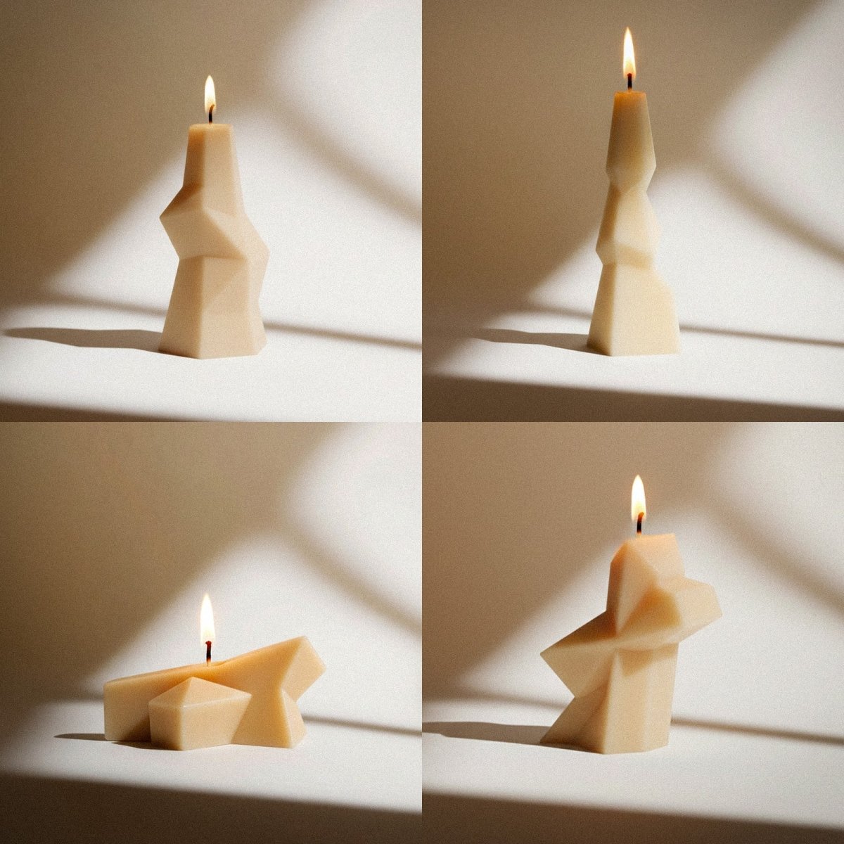 Four abstract geometric ivory candles burning on a neutral backdrop, showcasing the different sculptural shapes made with the silicone candle mold set - Boowan Nicole