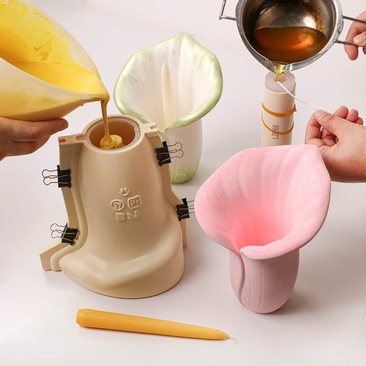 Pour the prepared concrete color and wax solution into the silicone mold with its outer shell - Boowan Nicole