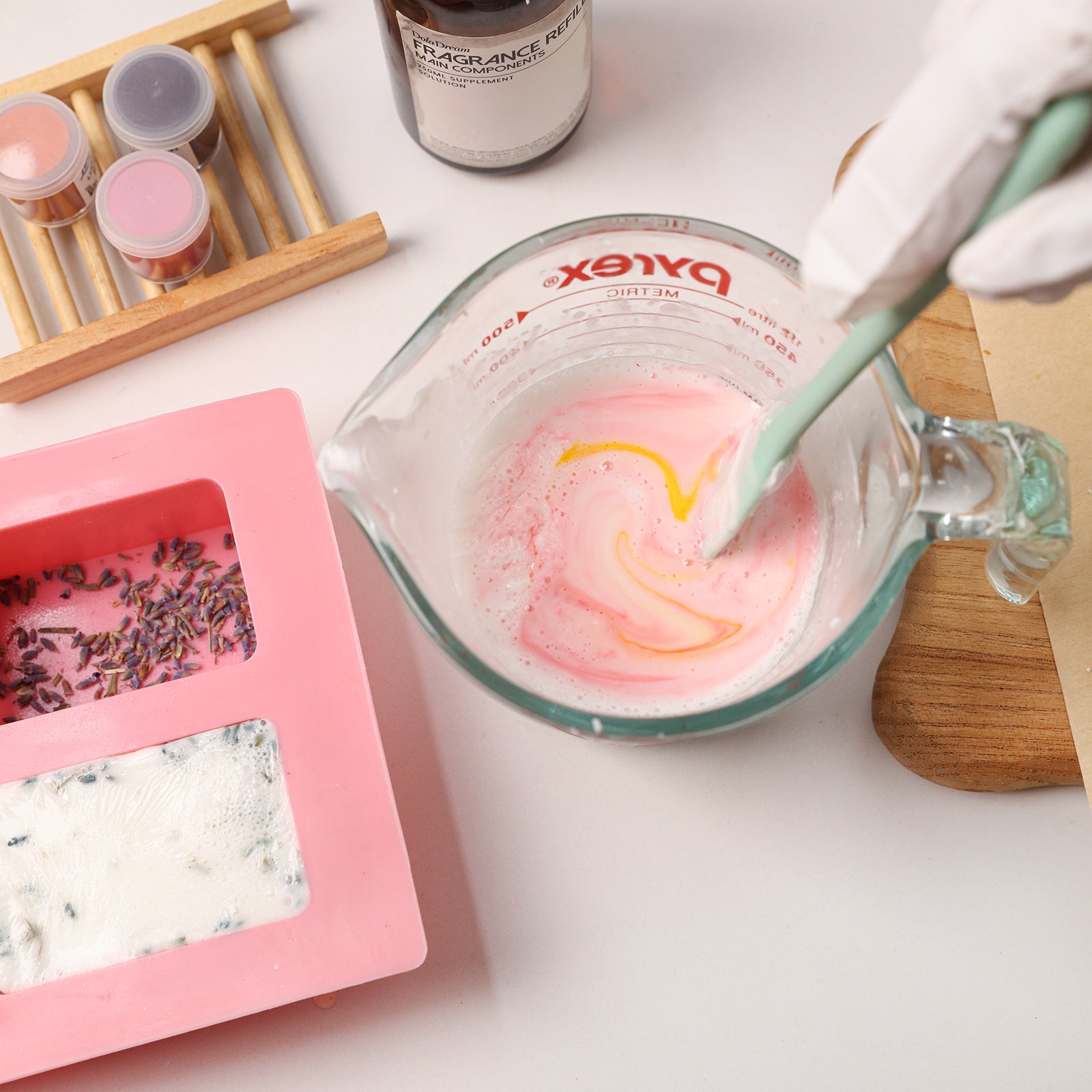 Mixing pink swirl Milk Essential Oil Soap Bar with lavender botanicals - Boowan Nicole