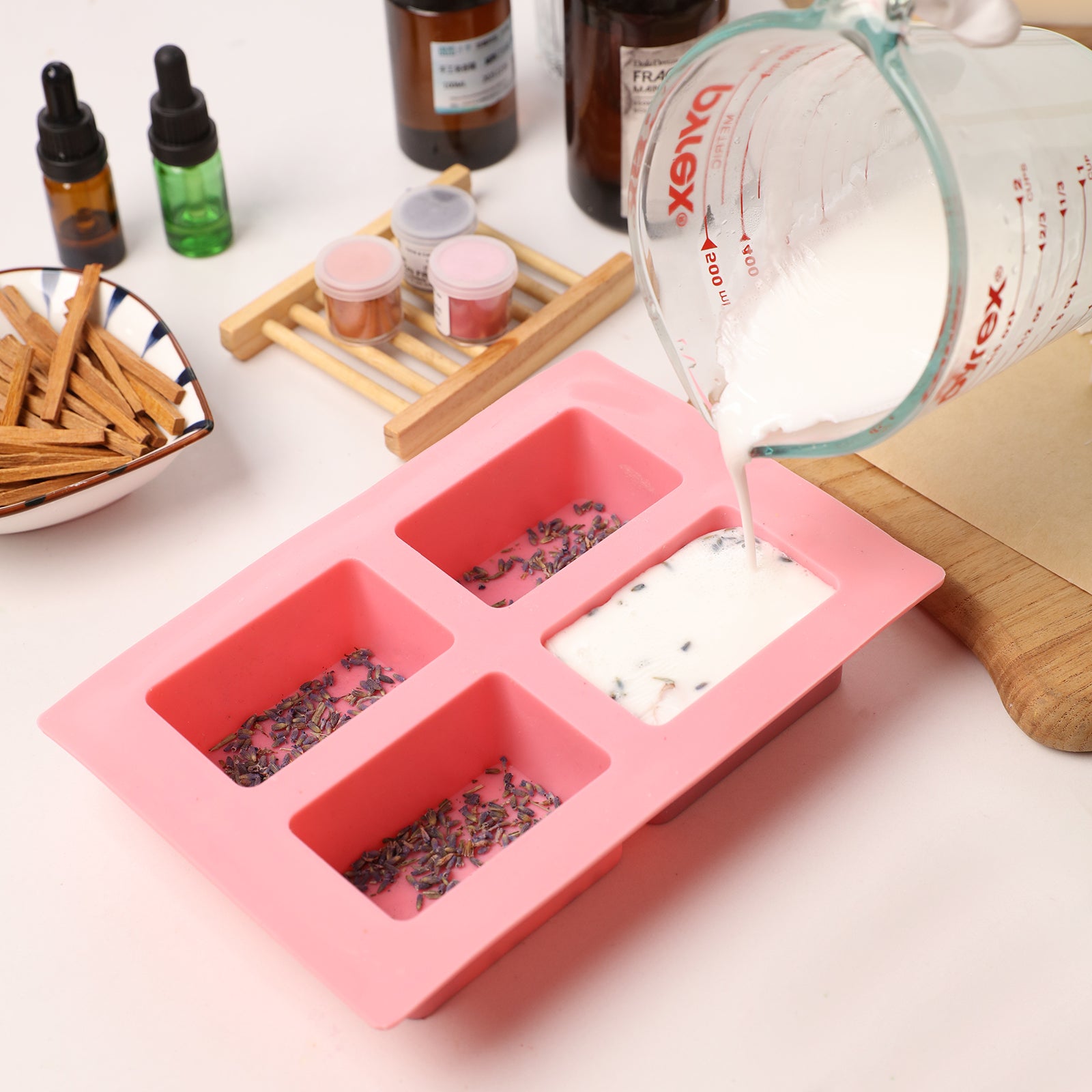 Mixing pink swirl Milk Cleaning Essential Oil Soap Bar with lavender botanicals.