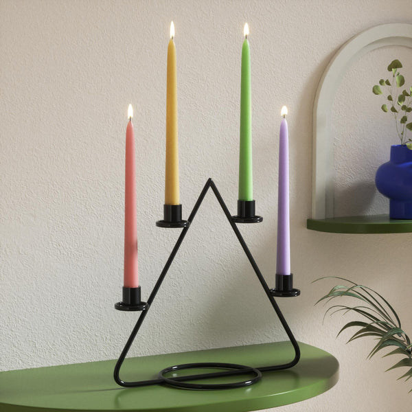 Handmade colored taper candles add ambiance to the home space-Boowan Nicole