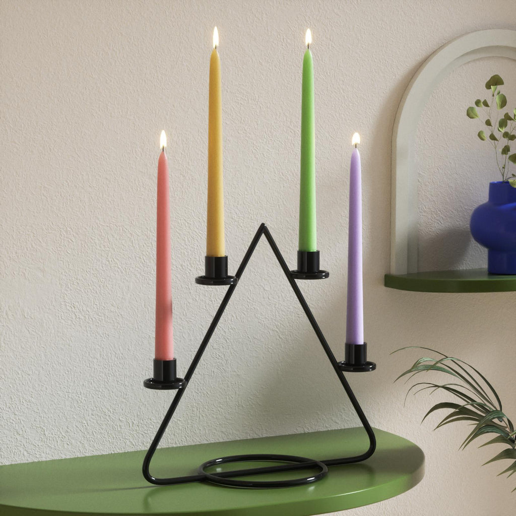 Handmade colored taper candles add ambiance to the home space-Boowan Nicole