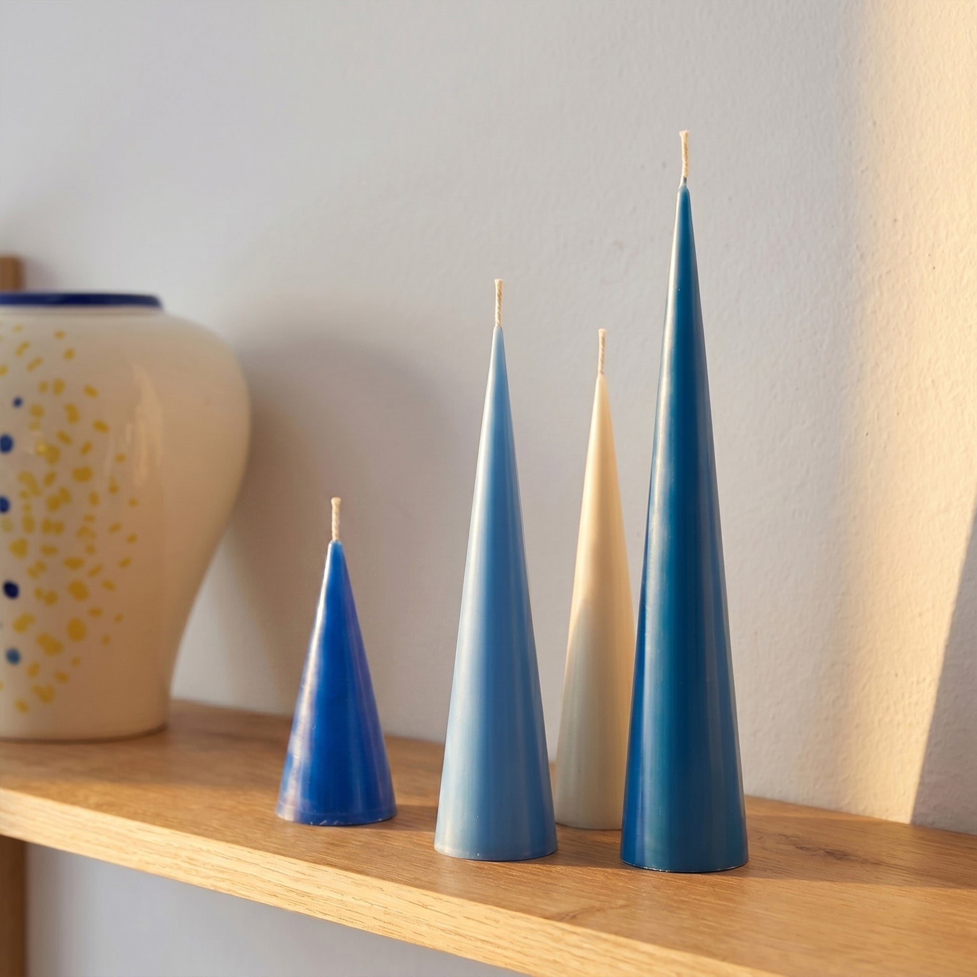 Conical Candles on Wooden Shelf - Boowan Nicole