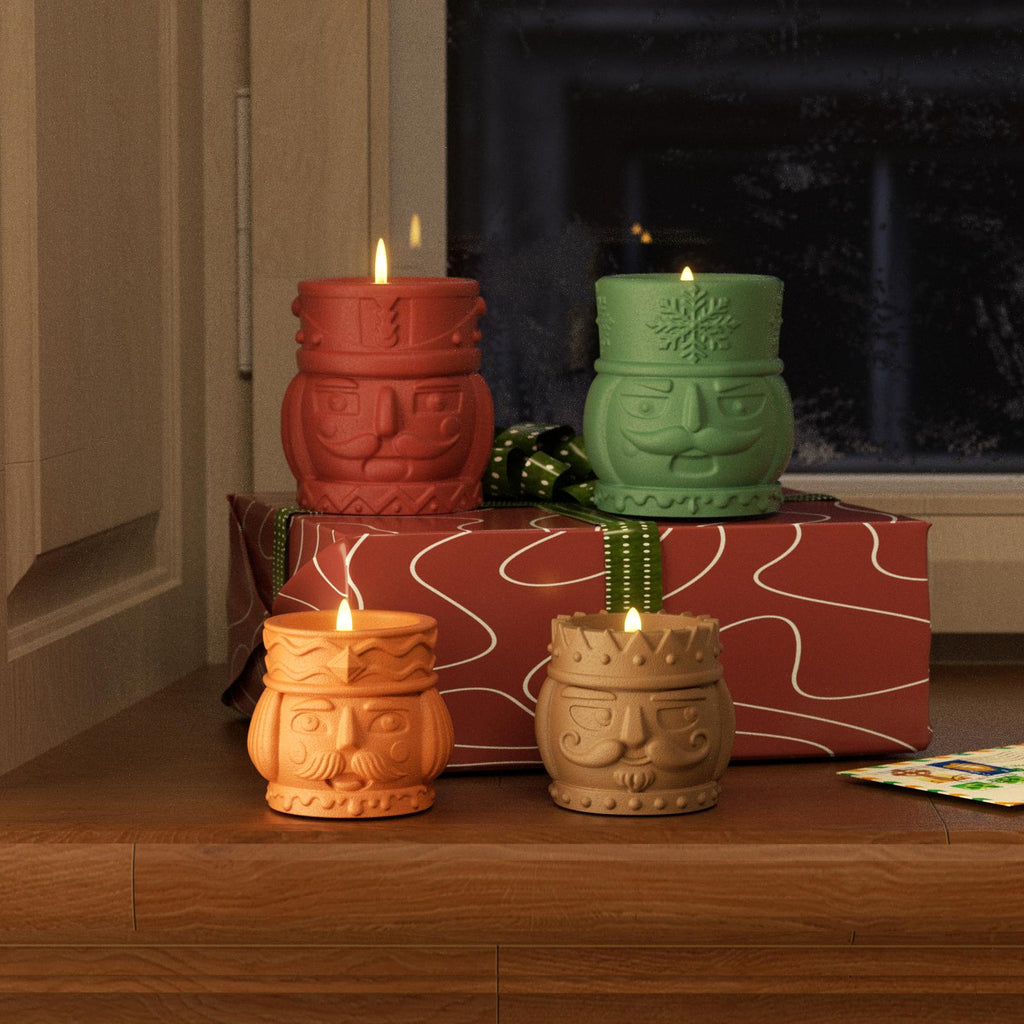 Festive nutcracker candle jars glowing in red, green, orange, and brown – perfect for DIY Christmas decor and gifting - Boowan Nicole