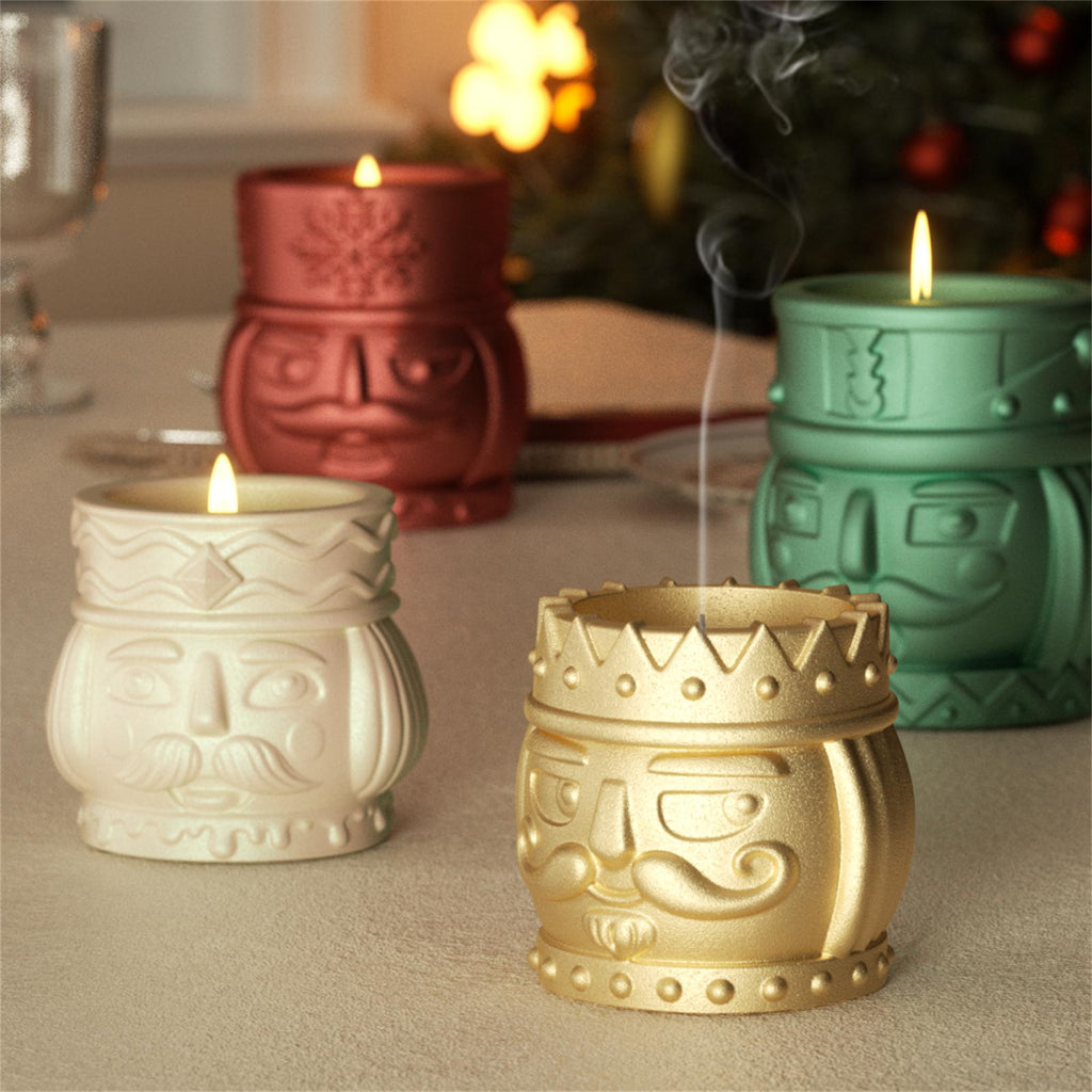 Festive nutcracker candles glowing and smoking on a Christmas table – holiday decor in white, gold, red, and green - Boowan Nicole
