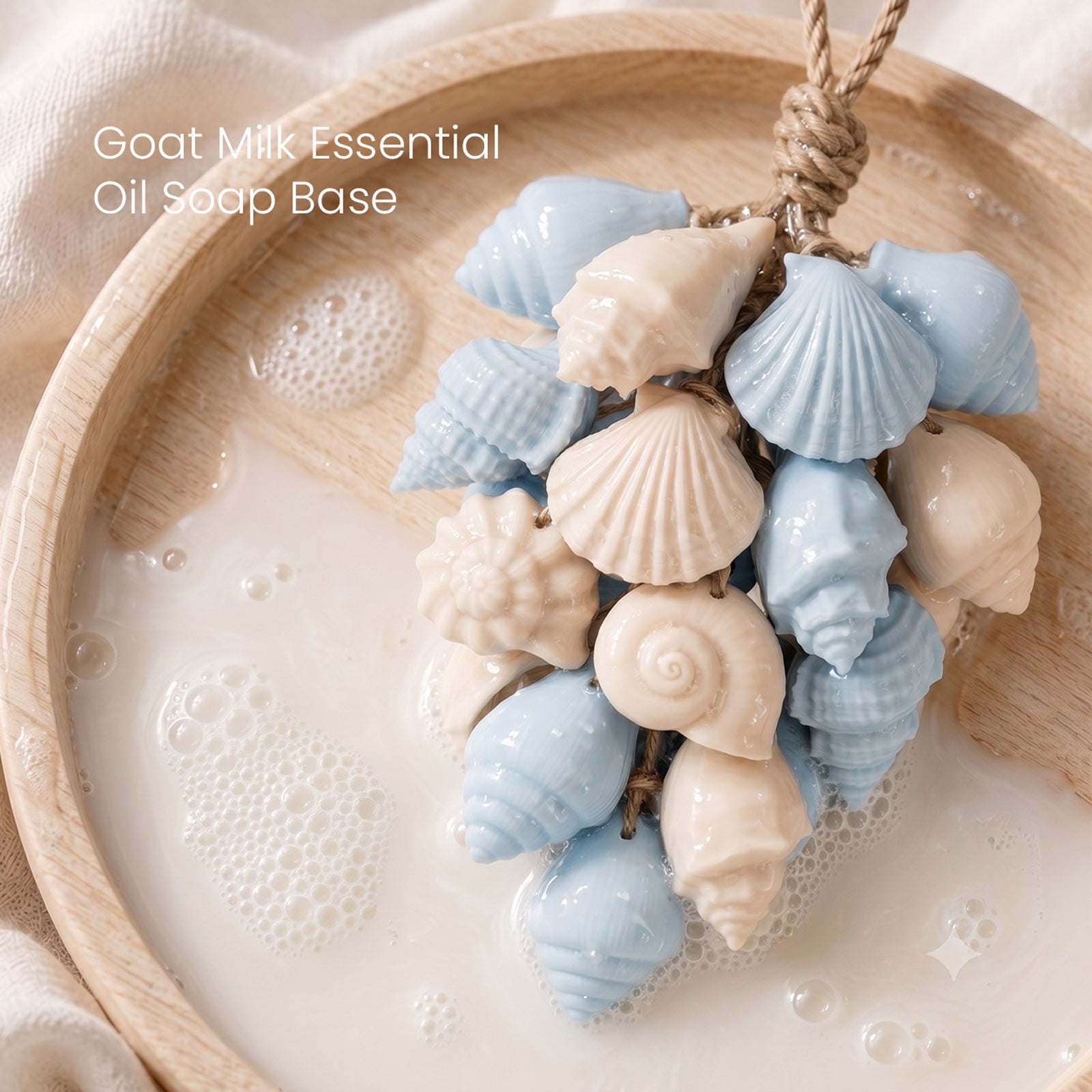 Glossy blue cream seashell hanging soap cluster soaked in goat milk soap foam on wooden tray - Boowan Nicole