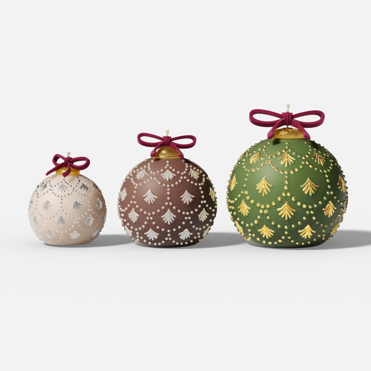 Three Christmas bauble candles (S/M/L) with fir-sprig and pearl-dot embossing, gold caps and ribbon bows—ivory, cocoa, and green—on a white background - Boowan Nicole