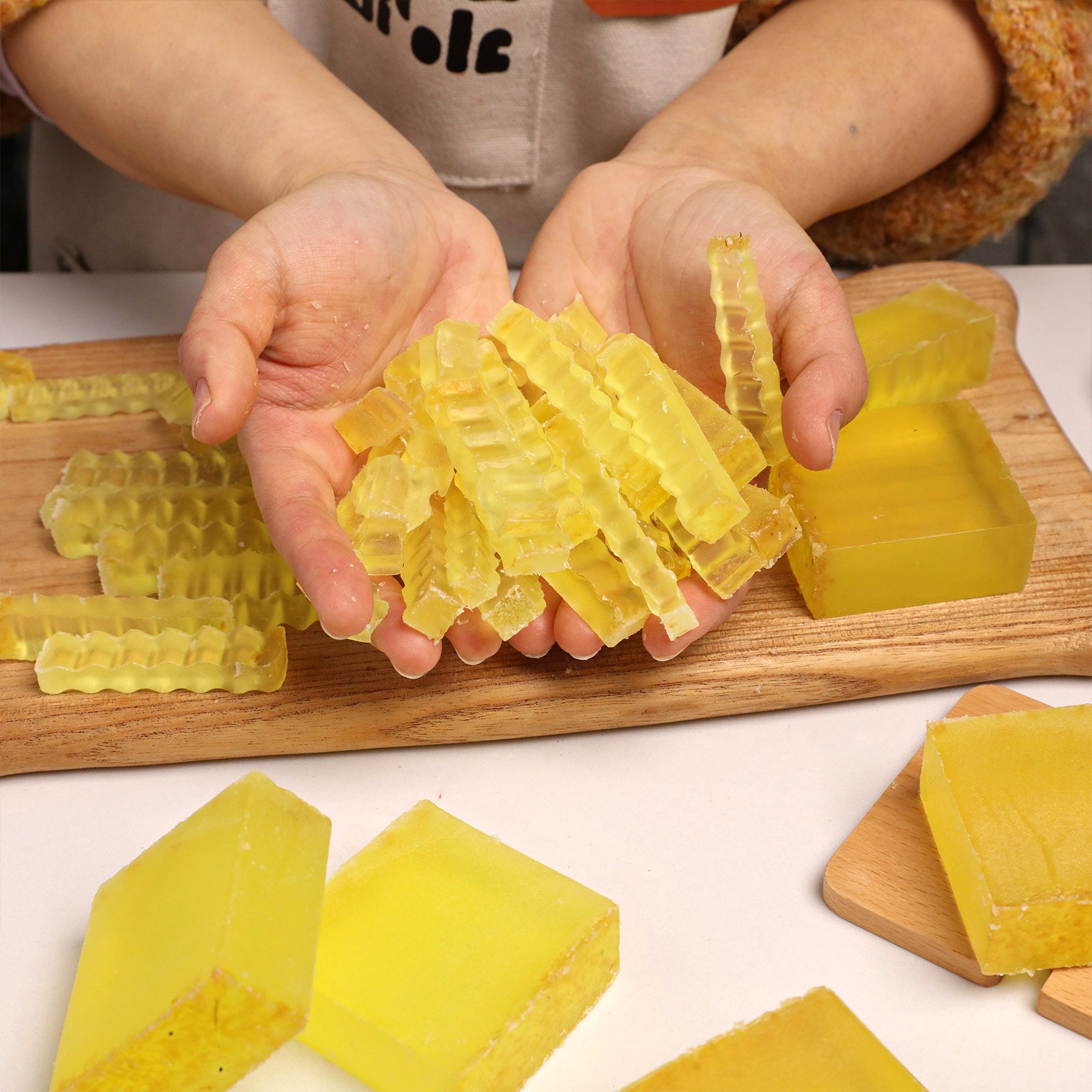 Hands Holding Cut Osmanthus Soap Cubes - Boowan Nicole