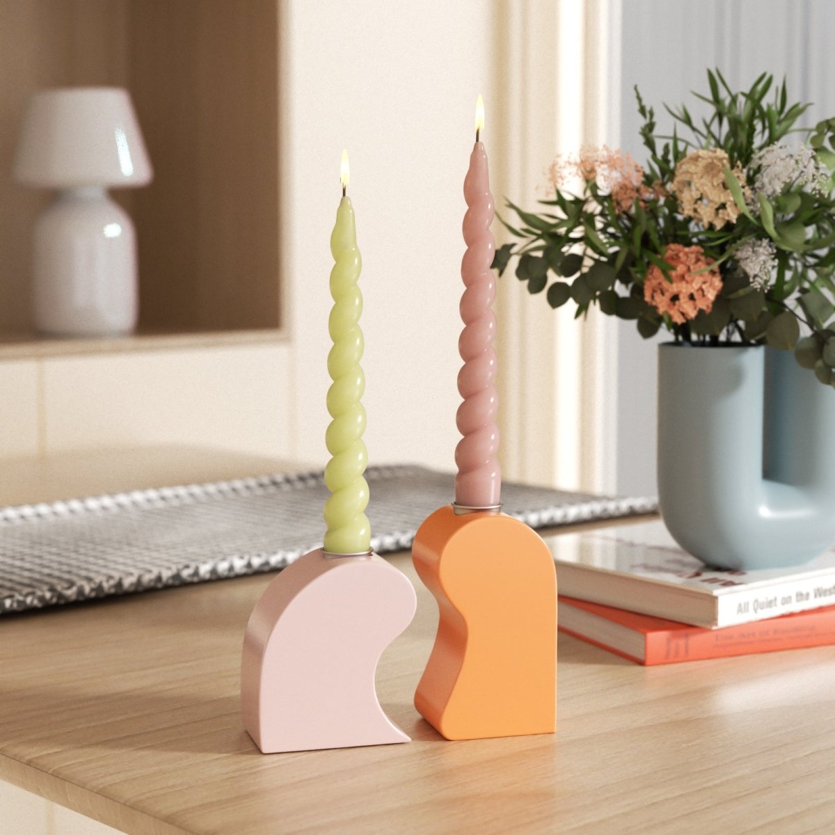 Colorful yellow and pink twisted taper candles in modern geometric holders, adding a playful touch to your home decor-Boowan Nicole