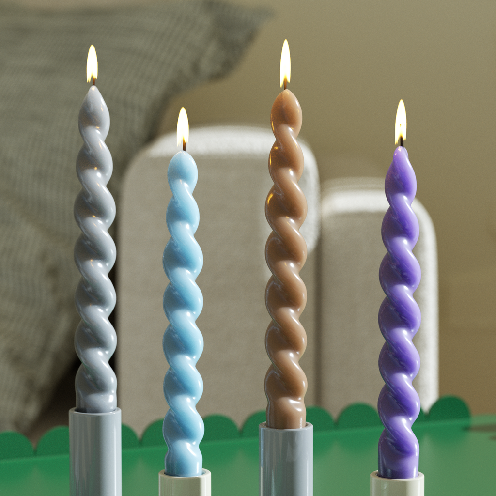 Twist candles in various colors lit to enhance the ambiance of your home decor-Boowan Nicole