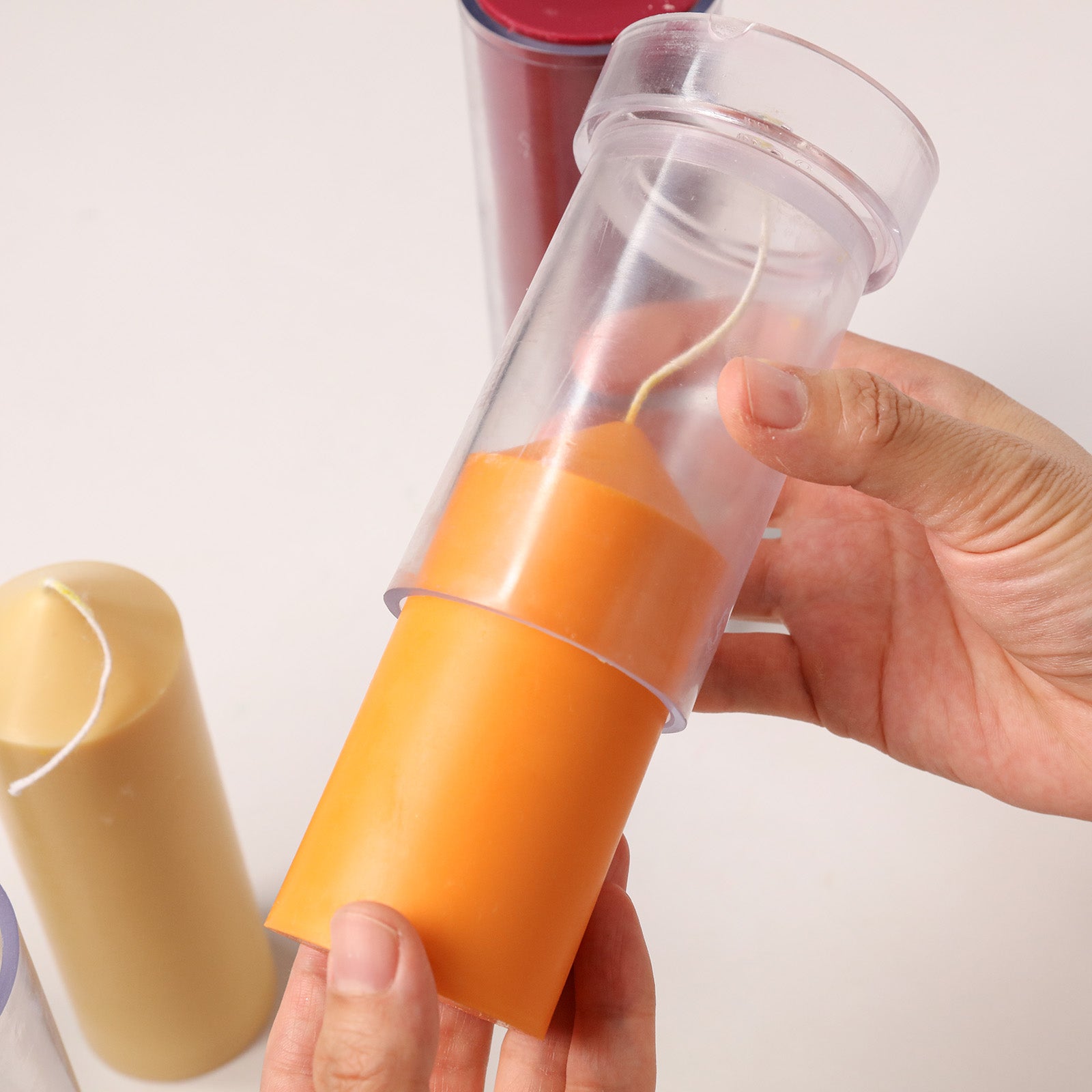 Demolding Orange Pointed Pillar Candle from Clear Acrylic Mold - Unmolding Process - Boowan Nicole
