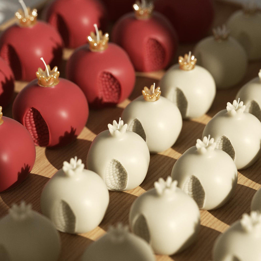 Batch-made pomegranate candles in red and ivory—perfect for festive decor or gifting - Boowan Nicole