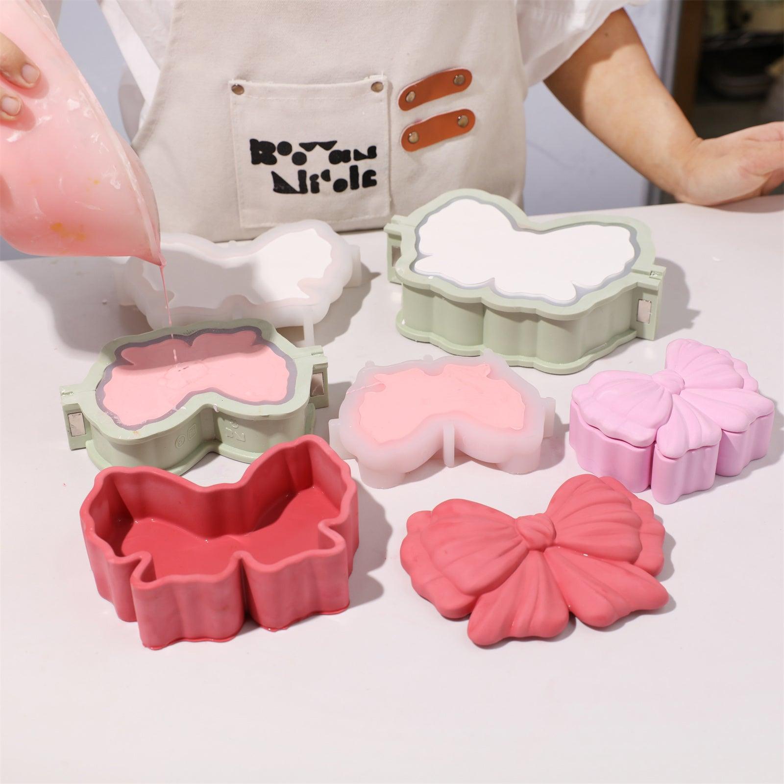 Pour pink concrete into the bow-shaped silicone mold with a support shell- Boowan Nicole